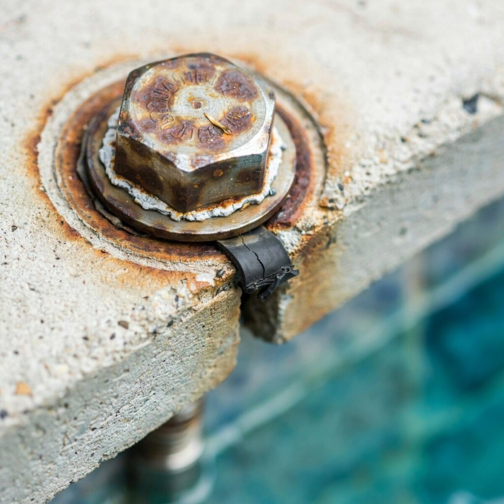 pool corrosion caused by low pH and aggressive pool water chemistry